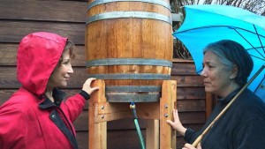 KCET's Val Zavala interviews Altadena gardener Emily Green (right) on the efficacy of rain barrels in Southern California. Photo: KCET/Twitter