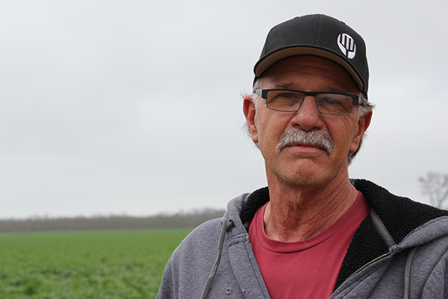 South Delta farmer Rudy Mussi stands in front of his alfalfa field to demonstrate why California's oldest water rights holders should not have to meter long-traditional flood irrigation.